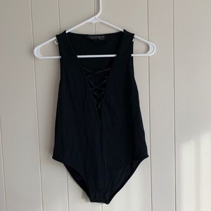 Gently used TOPSHOP black body suit w/ deep V